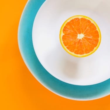 cut orange in a plate